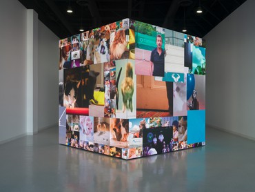 12-foot cube that displays a sequence of fragments from international television commercials