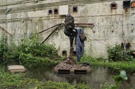 Tatiana Trouvé, The Residents, installation view, sculpture with jacket on water, Orford Ness, Suffolk, England