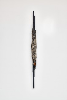 Christo, Package, 1961 Fabric, steel wire, rope, paint, lacquer paint, and wood, 54 ⅜ × 4 ¾ × 4 ¾ inches (138 × 12 × 12 cm)© Christo and Jeanne-Claude Foundation. Photo: Thomas Lannes