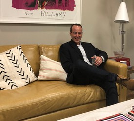 Luke Nikas, with Deborah Kass’s Vote Hillary (2016) on wall.