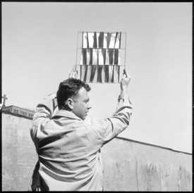 Ellsworth Kelly with a brass model for Sculptural Screen in Brass, 1957