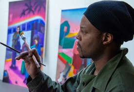 Titus Kaphar in his studio, painting
