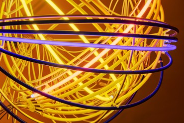 Sculpture comprised of concentric circles of neon tubing that light up