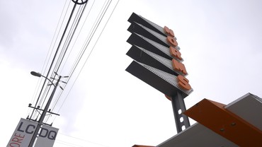 Still from Ed Ruscha’s film L.A. Restaurants, 2019, showing the sign on Norms restaurant in Los Angeles